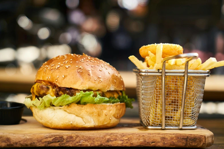 a hamburger and french fries on a cutting board, a portrait, unsplash, australian, 🦩🪐🐞👩🏻🦳, brown, crispy buns