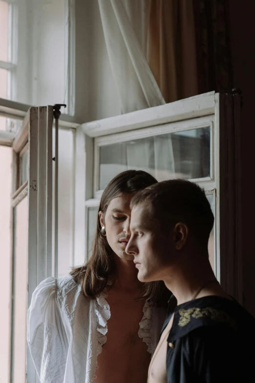 a man and a woman looking out a window, by Emma Andijewska, delicate androgynous prince, lut, leaving a room, lesbian