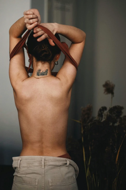 a man that has a tattoo on his back, a tattoo, inspired by Elsa Bleda, trending on pexels, renaissance, brunette woman, disrobed, color photo, relaxed posture