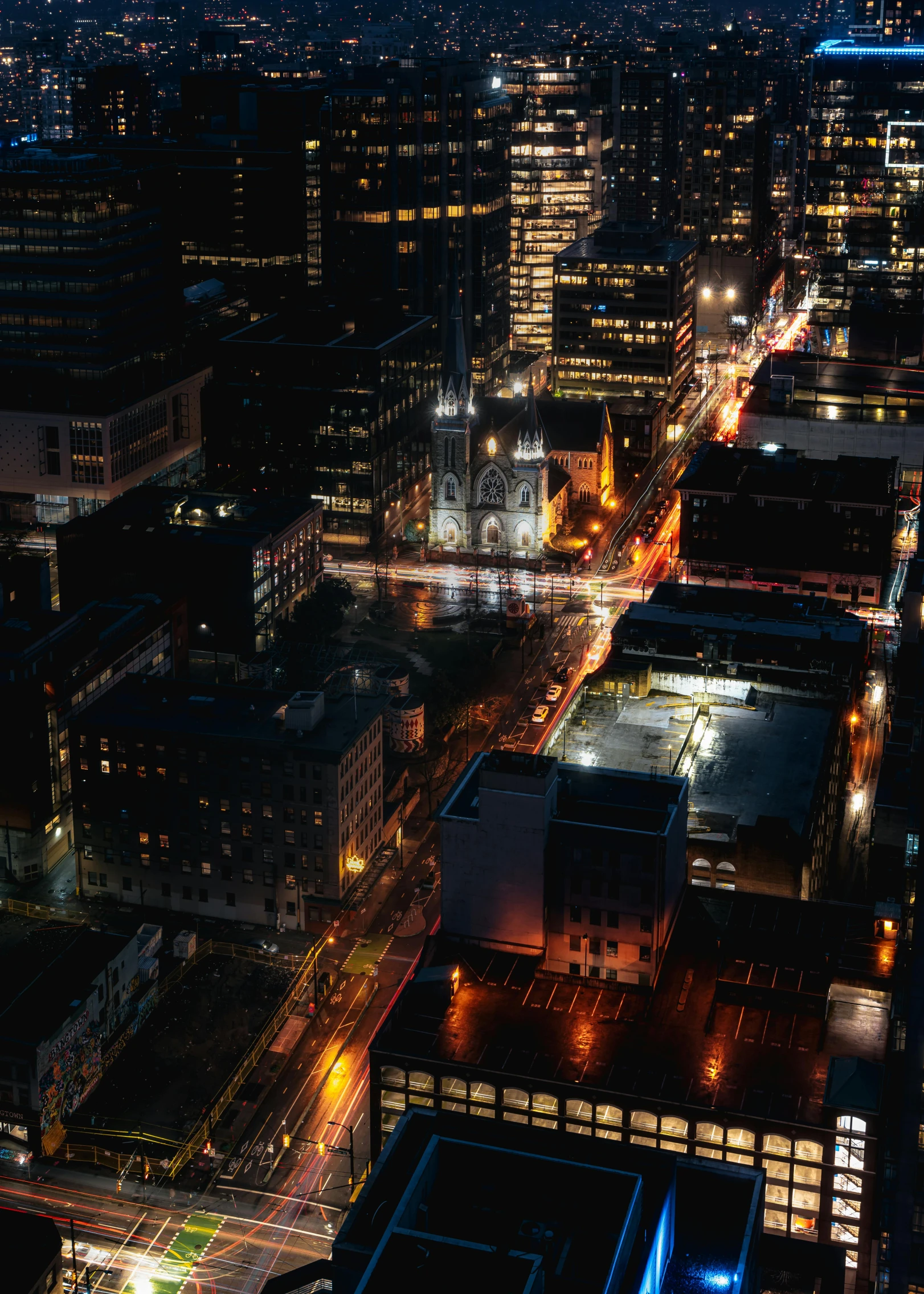 an aerial view of a city at night, by Greg Rutkowski, pexels contest winner, photorealism, photographic isometric cathedral, montreal, city street cinematic lighting, fine art print