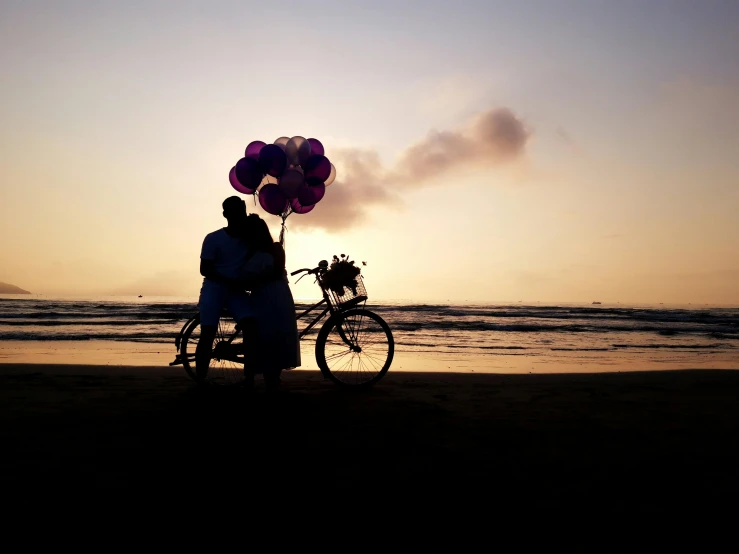 a couple standing next to a bike on a beach, by Lucia Peka, pexels contest winner, baloons, purples, end of day, profile image