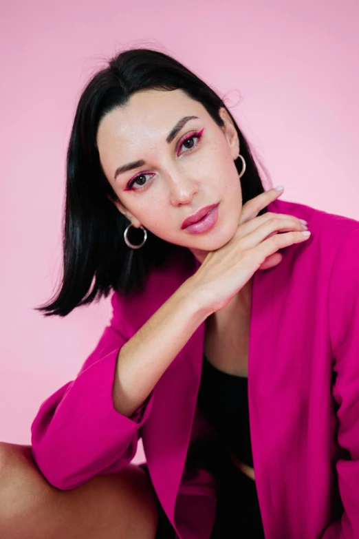 a woman in a pink jacket posing for a picture, by Julia Pishtar, trending on pexels, antipodeans, with black hair, maxim sukharev, фото девушка курит, 1614572159