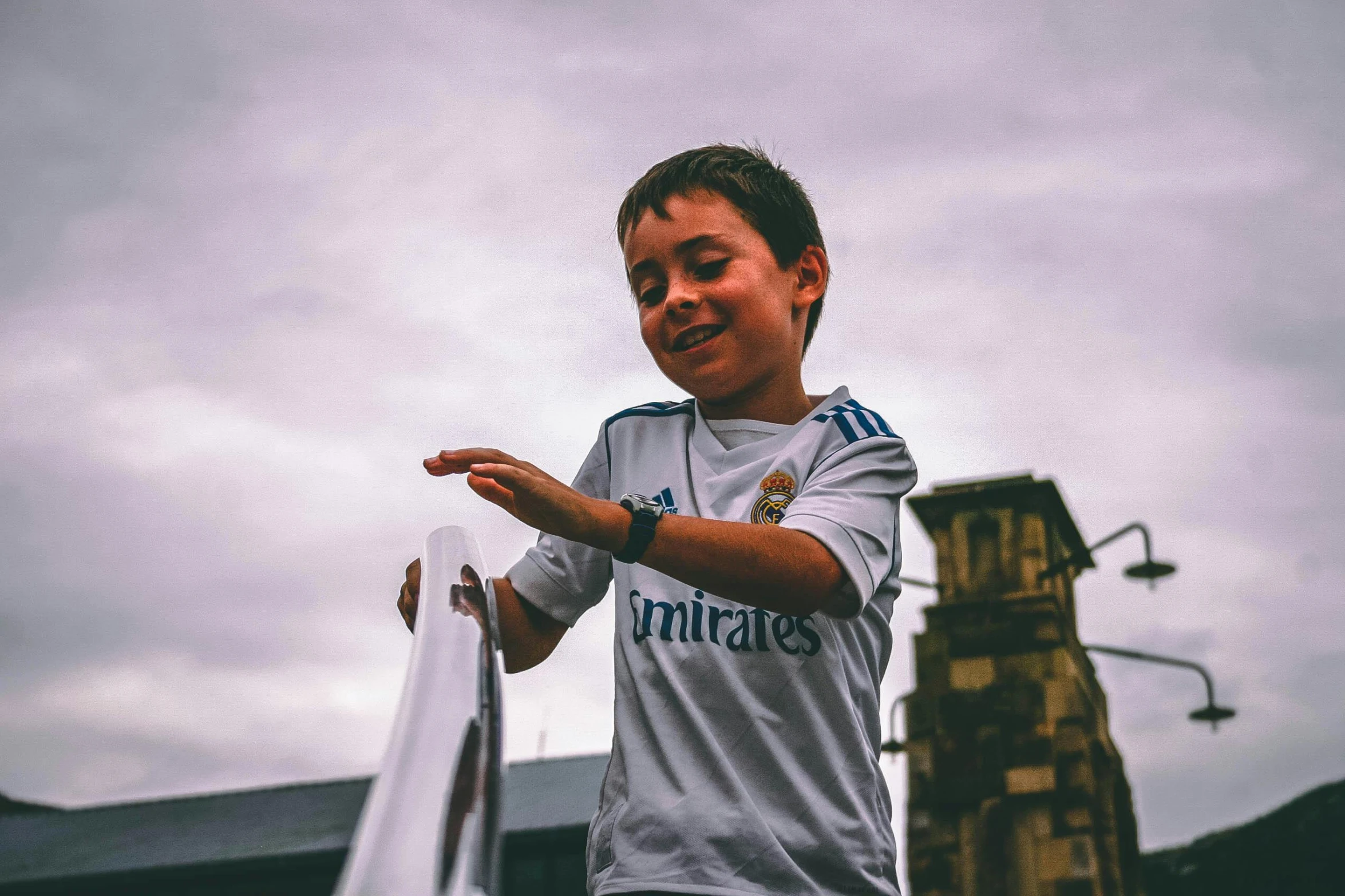 a young man holding a tennis racquet on top of a tennis court, by Daniel Lieske, pexels contest winner, graffiti, kid named finger, soccer player cristiano ronaldo, giving a thumbs up, little boy wearing nun outfit