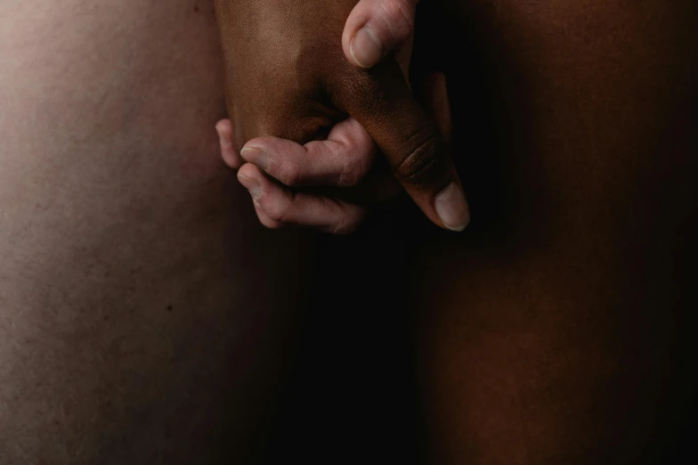 a close up of a person holding their stomach, by Elsa Bleda, mannerism, holding hands, light-brown skin, two male, mixed art
