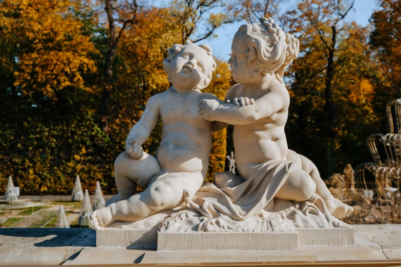 a couple of statues sitting next to each other, a marble sculpture, by Antoni Brodowski, pexels contest winner, fall season, children, rococo elements, slide show