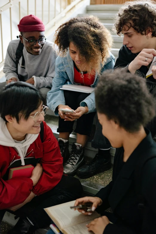 a group of young people sitting around each other, happening, varying ethnicities, taken on an iphone, schools, compassionate