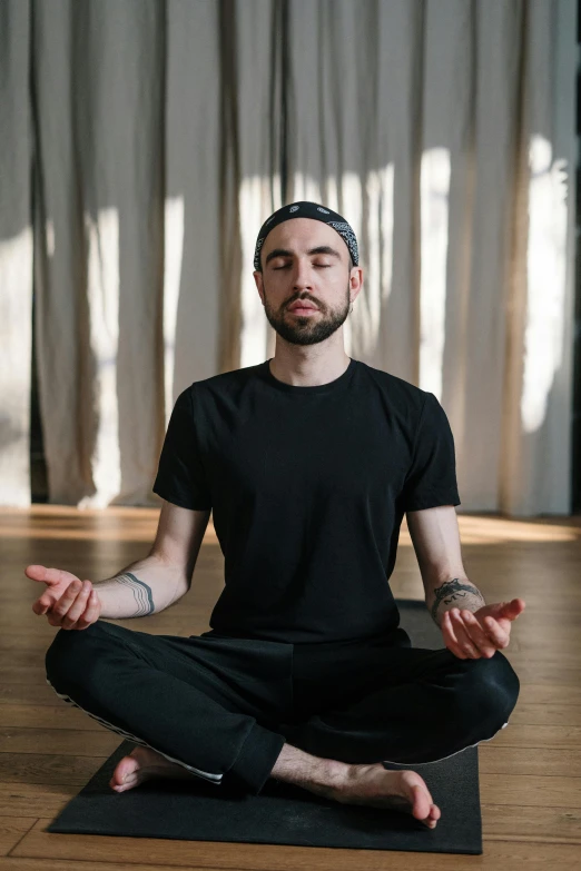 a man sitting in the middle of a yoga pose, a portrait, pexels contest winner, renaissance, lgbtq, head is centered, low quality photo, h3h3