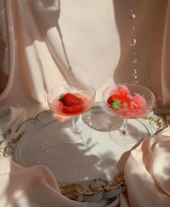 a couple of wine glasses sitting on top of a tray, a still life, inspired by Elsa Bleda, unsplash contest winner, romanticism, strawberry ice cream, ilustration, taken on iphone 1 3 pro, high-quality photo