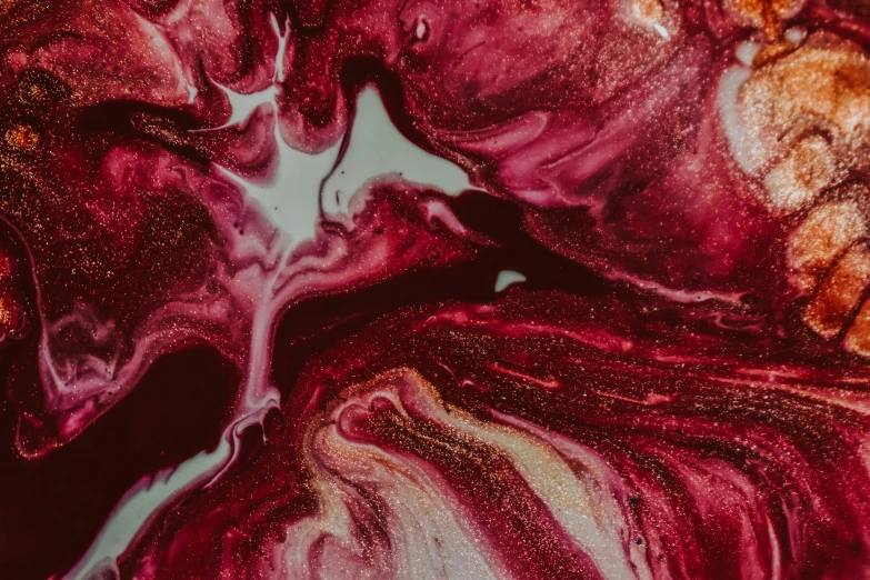 a close up of a piece of food on a plate, inspired by Julian Schnabel, trending on pexels, abstract expressionism, river of blood, pearlescent skin, swirls, maroon