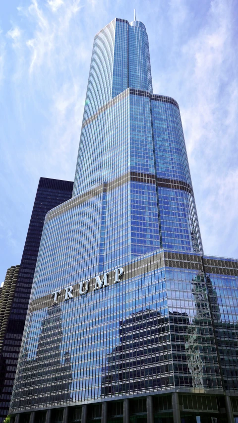 a tall building sitting in the middle of a city, trump tower, full of clear glass facades, award-winning”, frontal