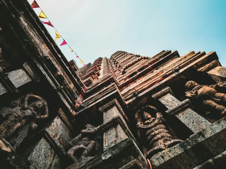 a very tall building with some statues on it, unsplash contest winner, cybertronic hindu temple, nepali architecture buildings, thumbnail, view from ground