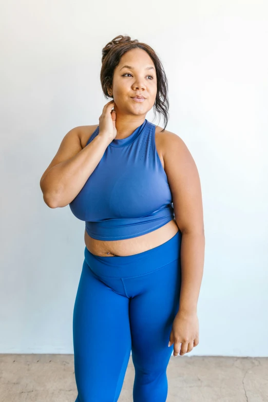 a woman in a blue top and blue leggings, wearing a crop top, varying thickness, kezie demessance, official store photo