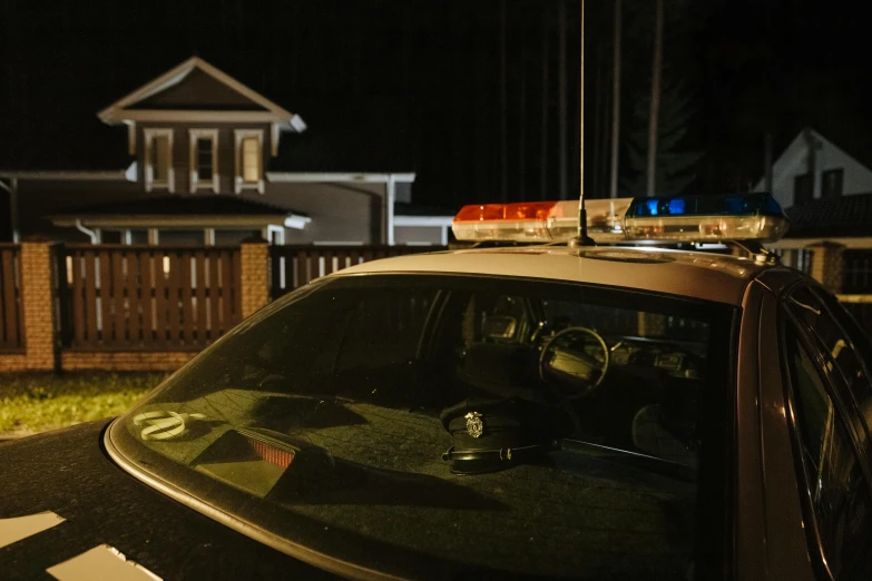 a police car parked in front of a house at night, pexels contest winner, profile image, murder scene, high resolution photo, a wooden