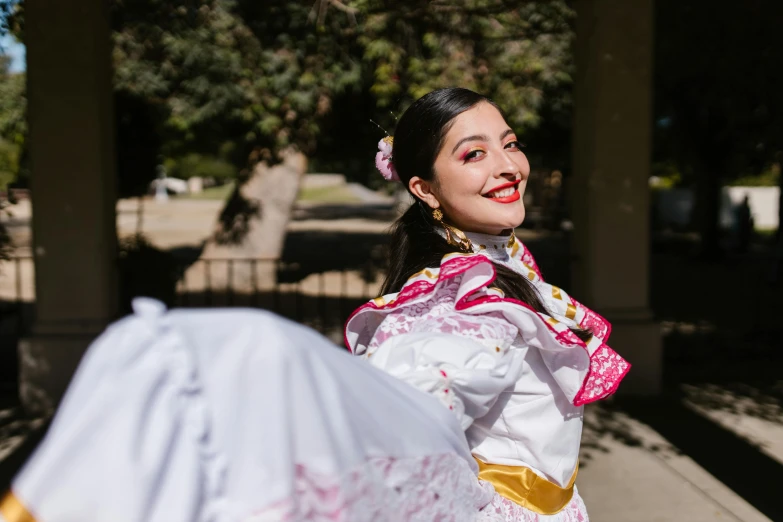 a woman in a white dress holding a white umbrella, an album cover, by Olivia Peguero, pexels contest winner, folklorico, happily smiling at the camera, 15081959 21121991 01012000 4k, in a sunny day