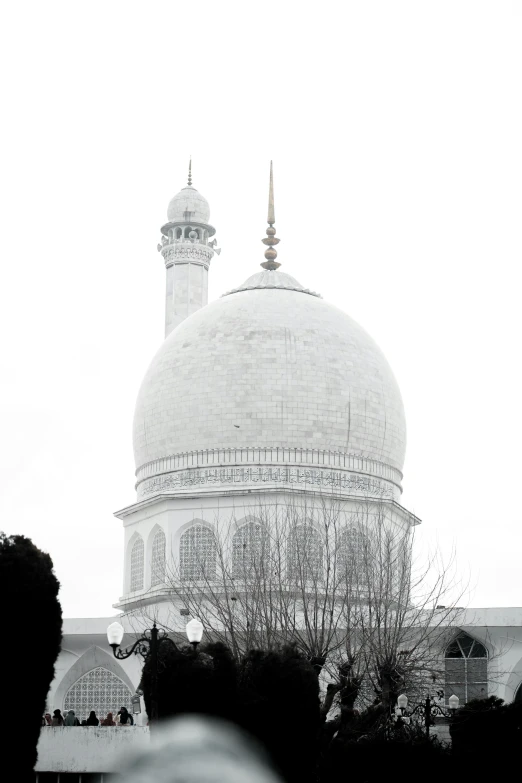 a black and white photo of a large building, a marble sculpture, inspired by Abdullah Gërguri, dome, covered with snow, colour corrected, distant shot