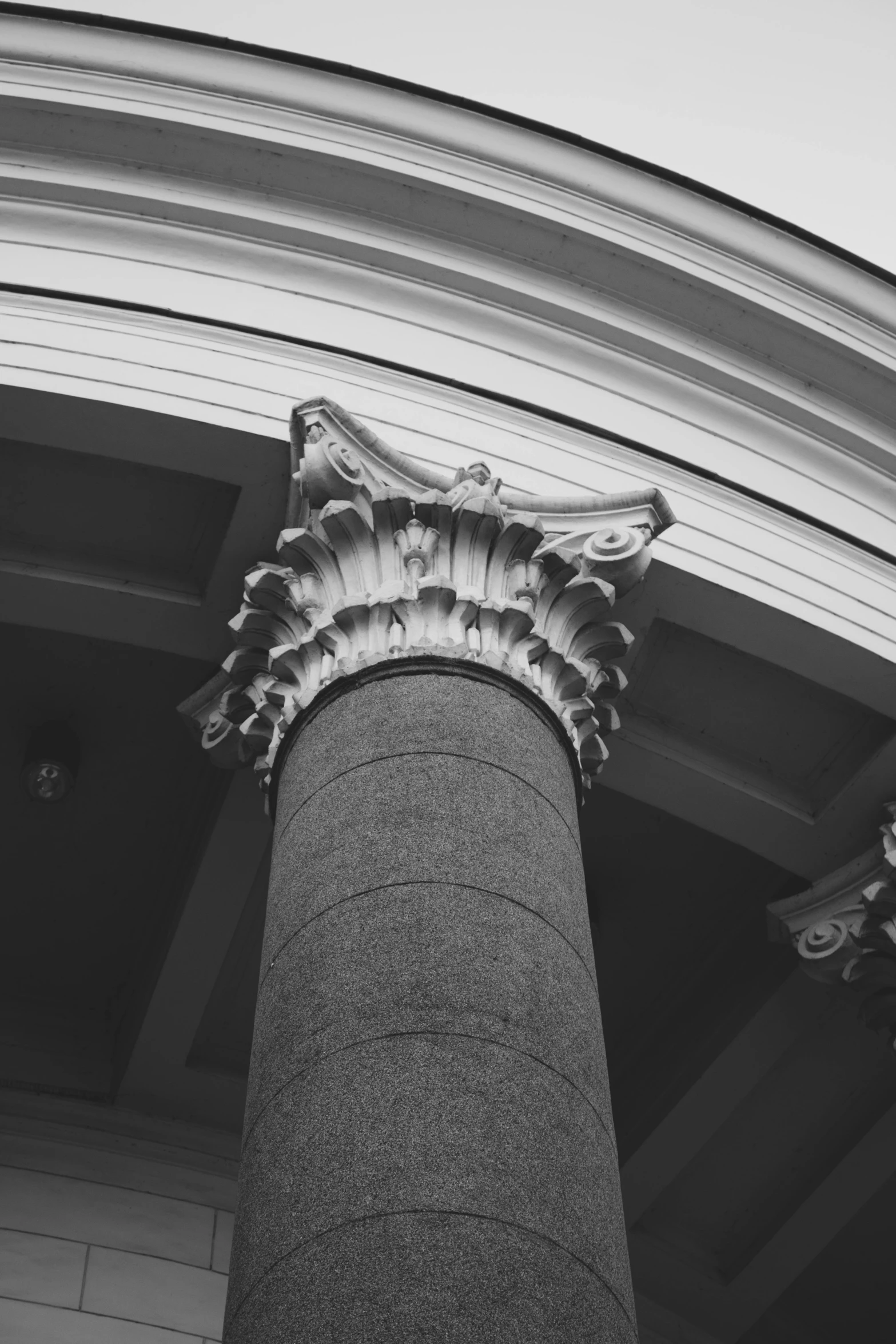 a black and white photo of a column, inspired by Sir Jacob Epstein, unsplash, neoclassicism, ornamental halo, high details photo, monochrome:-2, interesting shapes & form