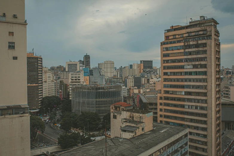 a view of a city from a high rise building, by Elsa Bleda, pexels contest winner, brutalism, brazilian, slight overcast lighting, tourist photo, panorama