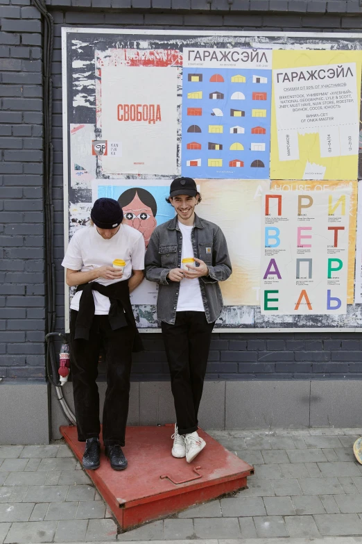 a couple of men standing next to each other on a sidewalk, graffiti, russian academic, non-binary, snacks, promotional image