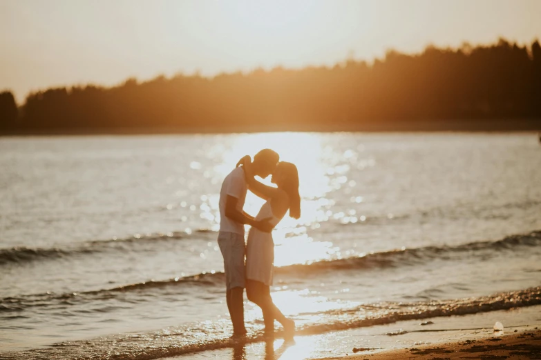 a couple kissing on the beach at sunset, pexels contest winner, espoo, fan favorite, backlight photo sample, white