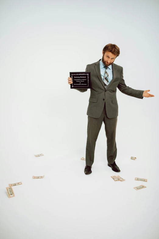 a man in a suit holding a sign surrounded by money, inspired by John E. Berninger, charlie day, press shot, levitating, mrbeast