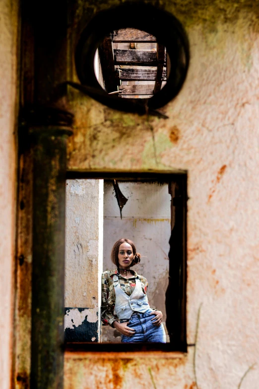 a woman taking a picture of herself in a mirror, a portrait, inspired by Elsa Bleda, renaissance, abandoned derelict buildings, portrait of a slightly rusty, shot with sony alpha, portait image