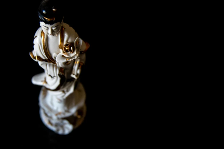 a figurine of a man riding a horse, inspired by Tawaraya Sōtatsu, unsplash, guanyin, high contrast, seen from straight above, baroque object