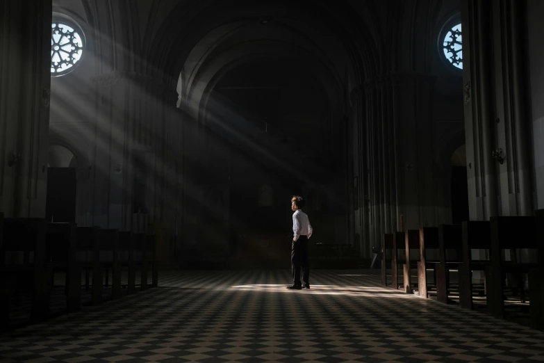 a man standing in the middle of a church, light and space, taken in 2 0 2 0, contre - jour, evenly lit, ignant