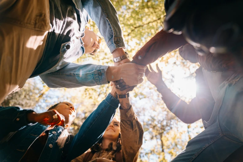 a group of people holding hands in a circle, pexels contest winner, laying under a tree on a farm, 15081959 21121991 01012000 4k, thumbnail, mechanics