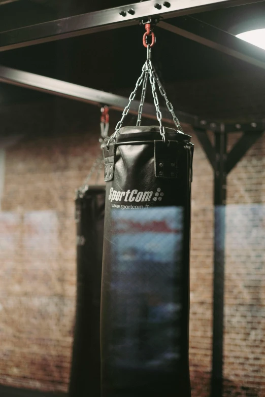 a punching bag hanging from a ceiling in a gym, poster art, pexels contest winner, happening, promo image, pistons, thumbnail, multiple stories