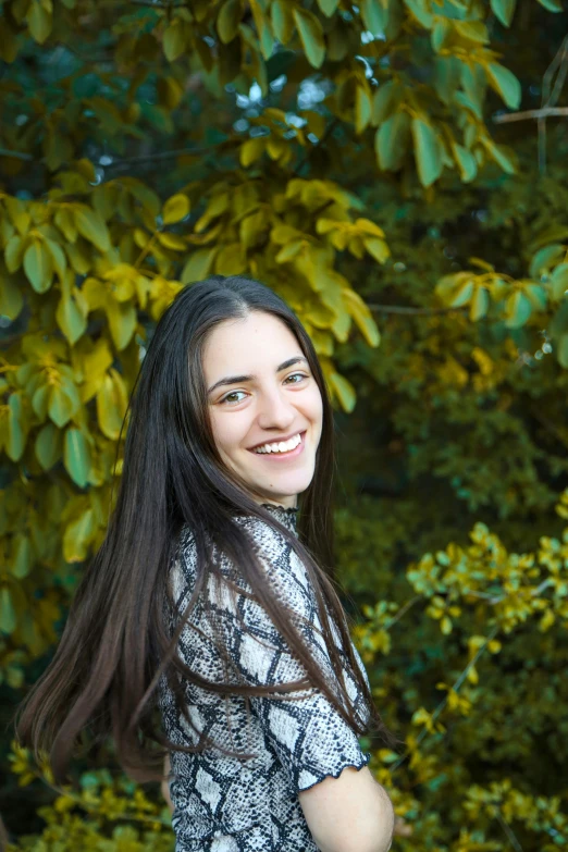 a woman standing in front of a tree with a frisbee in her hand, pexels contest winner, renaissance, headshot profile picture, young woman with long dark hair, ((portrait)), eytan zana