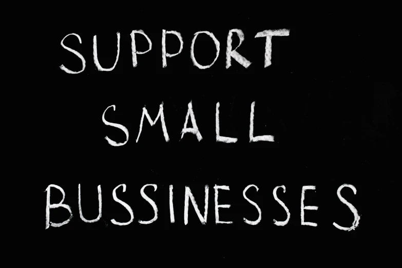 a blackboard with the words support small businesses written on it, by Primrose Pitman, pixabay, renaissance, smallest waistline, seamless, business card, sadness