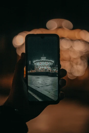 a person taking a picture with their cell phone, a picture, pexels contest winner, realism, night light, symmetrical image, full screen, zoomed out shot