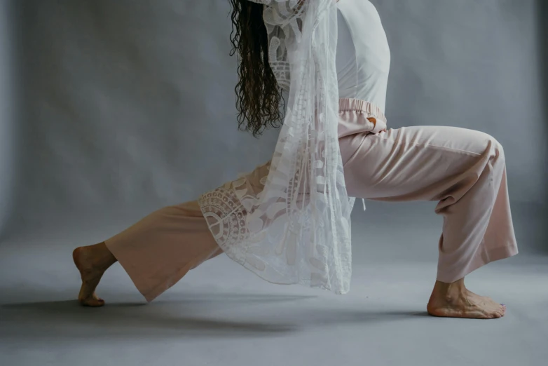 a woman in a white shirt and pink pants doing a yoga pose, trending on pexels, arabesque, dressed with long fluent clothes, white lace clothing, cinematic outfit photo, hyperedetailed photo