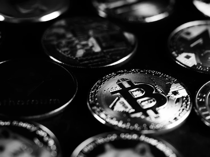 a bunch of bitcoins sitting on top of each other, a black and white photo, by Adam Rex, unsplash, fine art print, cryptidcore, shiny, closeup!!!!!!