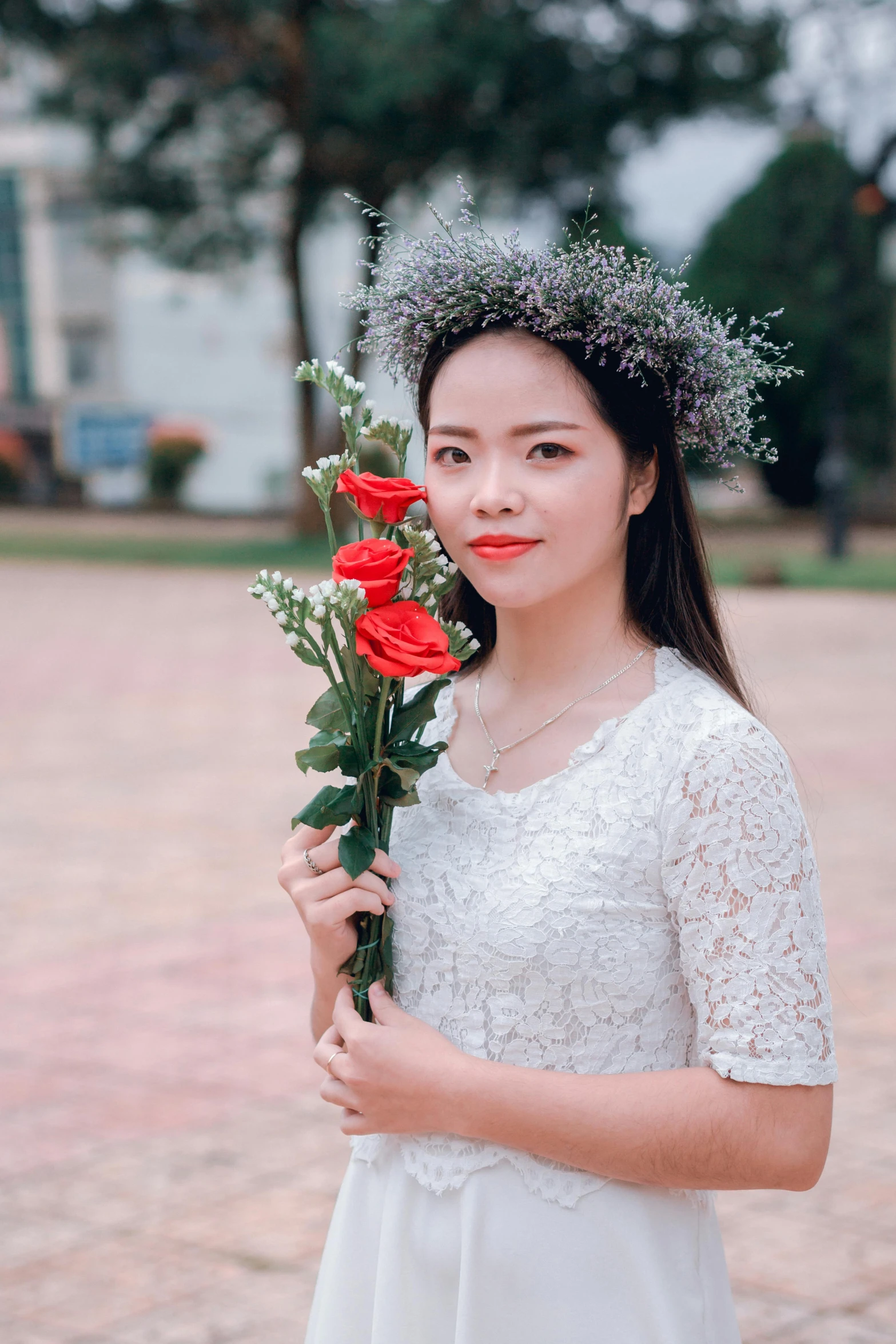 a woman in a white dress holding a red rose, inspired by Ruth Jên, pexels contest winner, vietnamese woman, avatar image, casual, wearing a light grey crown