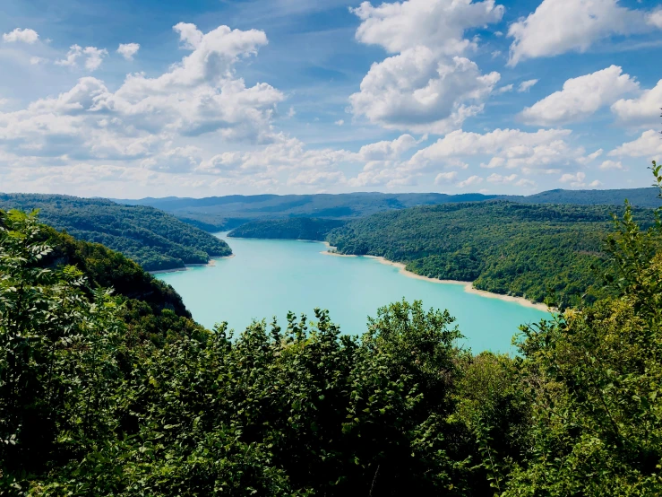 a large body of water surrounded by trees, pexels contest winner, renaissance, overlooking a valley, teal sky, austro - hungarian, thumbnail