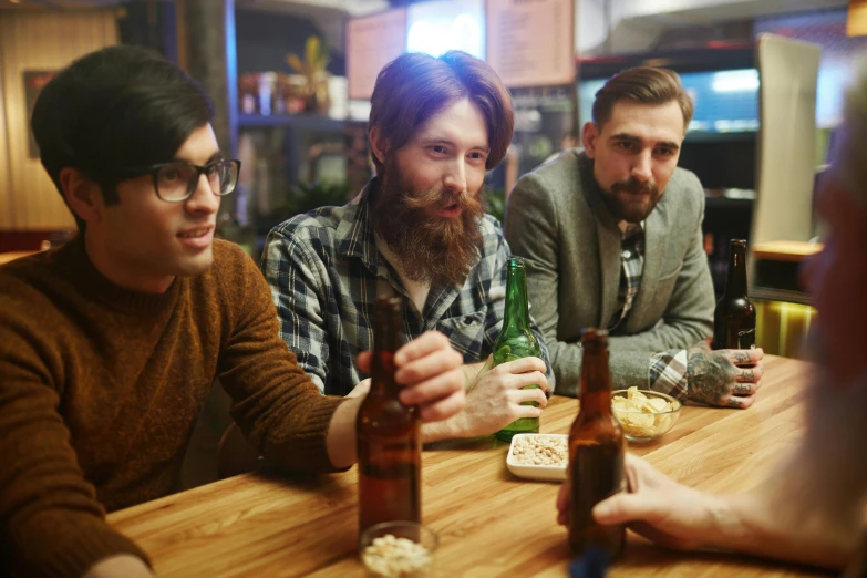 a group of men sitting around a wooden table, pexels, bearded, malt, looks realistic, hipster