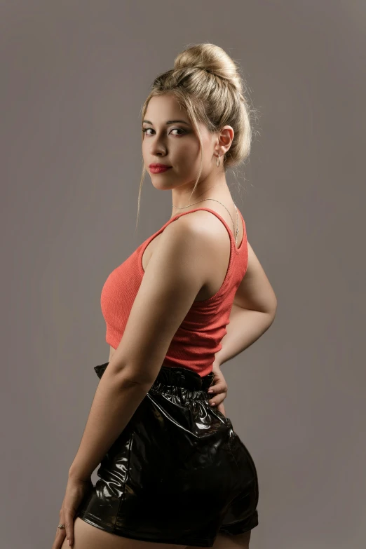 a woman in a short skirt posing for a picture, an album cover, pexels contest winner, studio!! portrait lighting, red tank-top, profile image, scarlett hooft