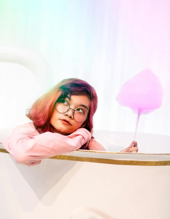 a woman that is sitting in a cup, inspired by Hikari Shimoda, trending on unsplash, made of cotton candy, pink glasses, bathtub, low quality photo