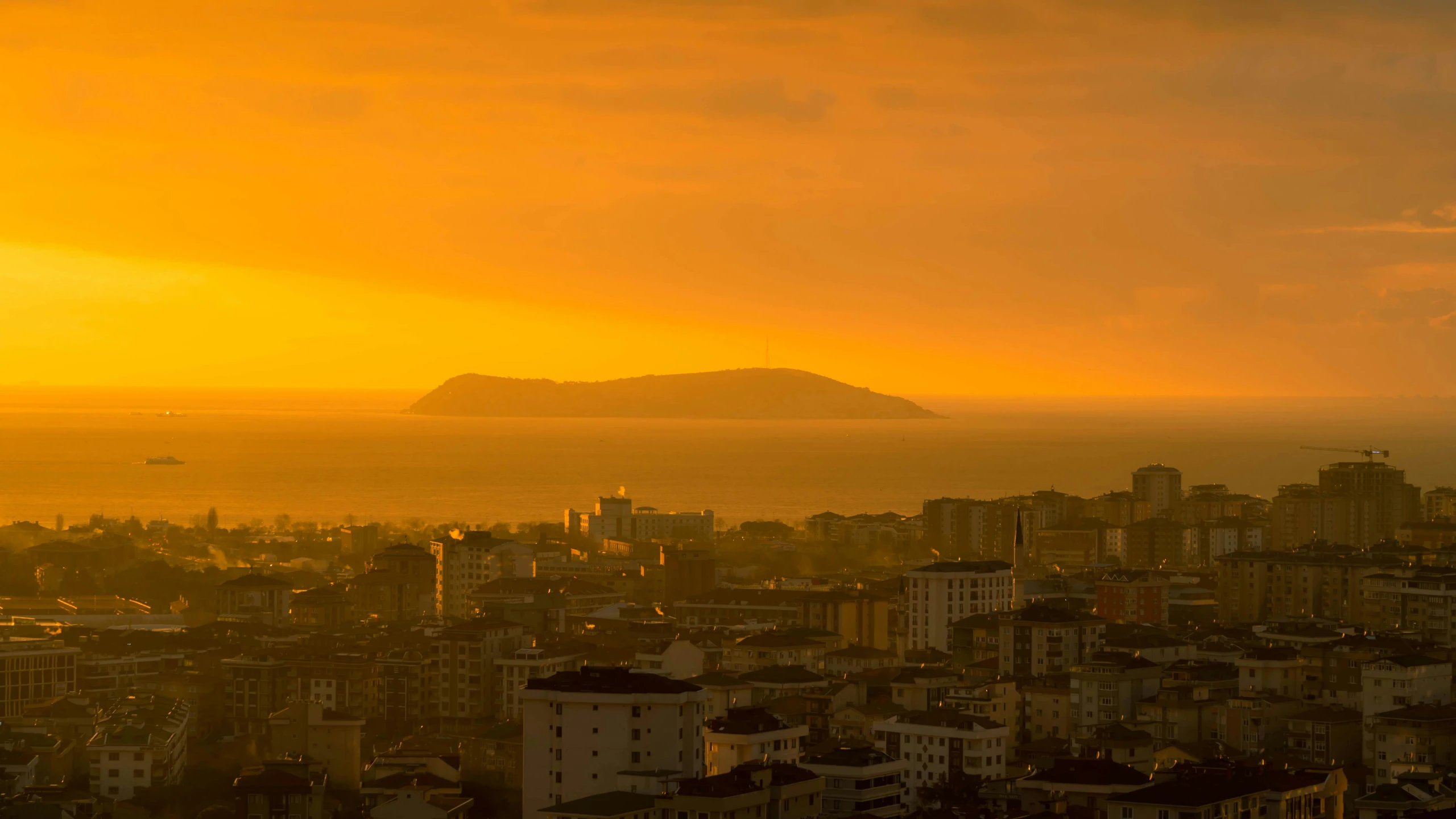 a view of a city from the top of a hill, by Matt Stewart, pexels contest winner, art nouveau, yellow sky, turkey, nuclear sunset, guwahati