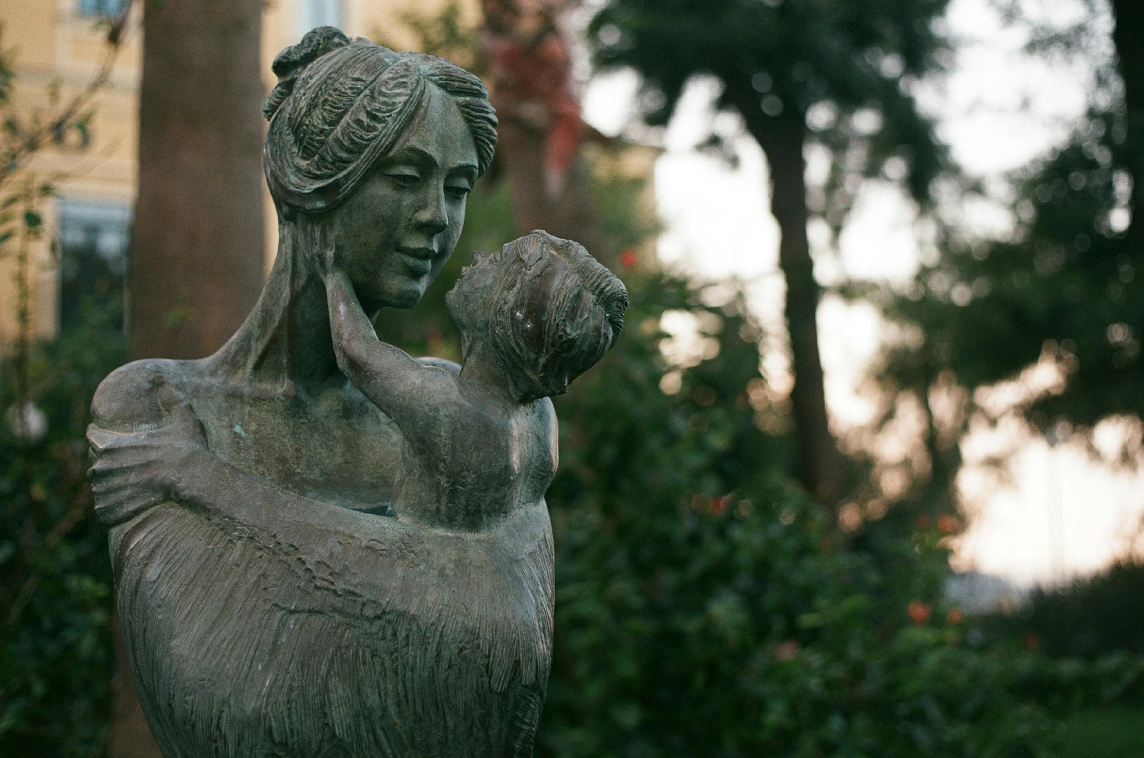 a statue of a woman holding a baby, by Alejandro Obregón, unsplash, new sculpture, marbella, maria fortuny, in savannah, early in the morning