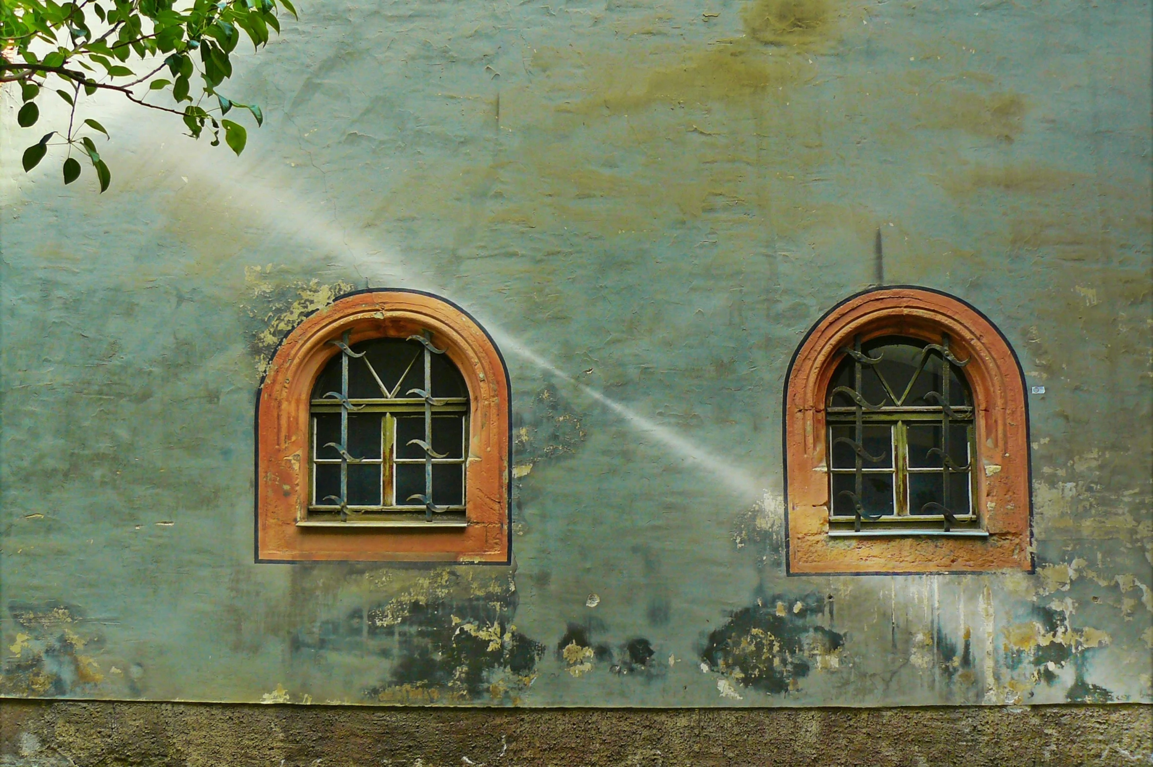 a fire hydrant in front of a building with two windows, by Jan Rustem, pexels contest winner, graffiti, sweeping arches, irrigation, old color photograph, background image