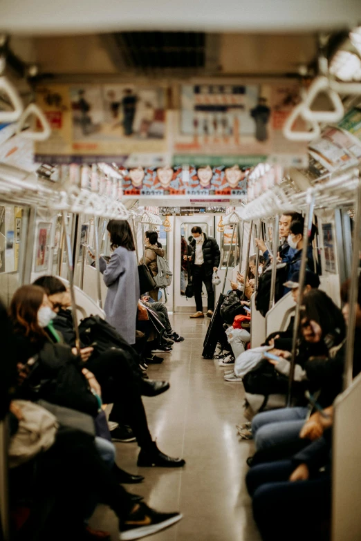 a group of people sitting on a subway train, trending on unsplash, in a japanese apartment, underground city, 🚿🗝📝