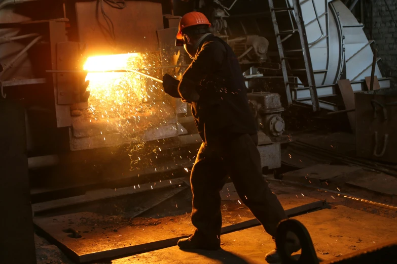 a man that is standing in front of a fire, steel mill, wielding a crowbar, profile image, reuters