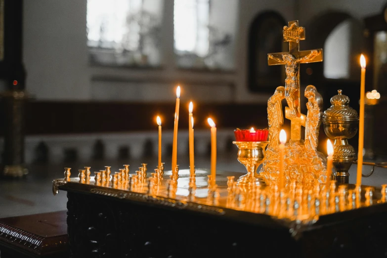 a group of candles sitting on top of a table, standing in a church, profile image, fan favorite, orthodoxy