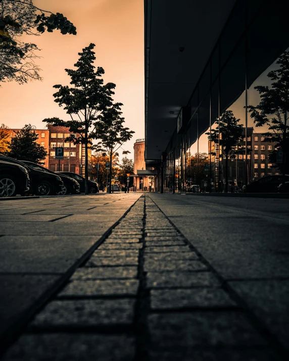 a black and white photo of a city street, pexels contest winner, golden hour hues, ground level view, hannover, color photo