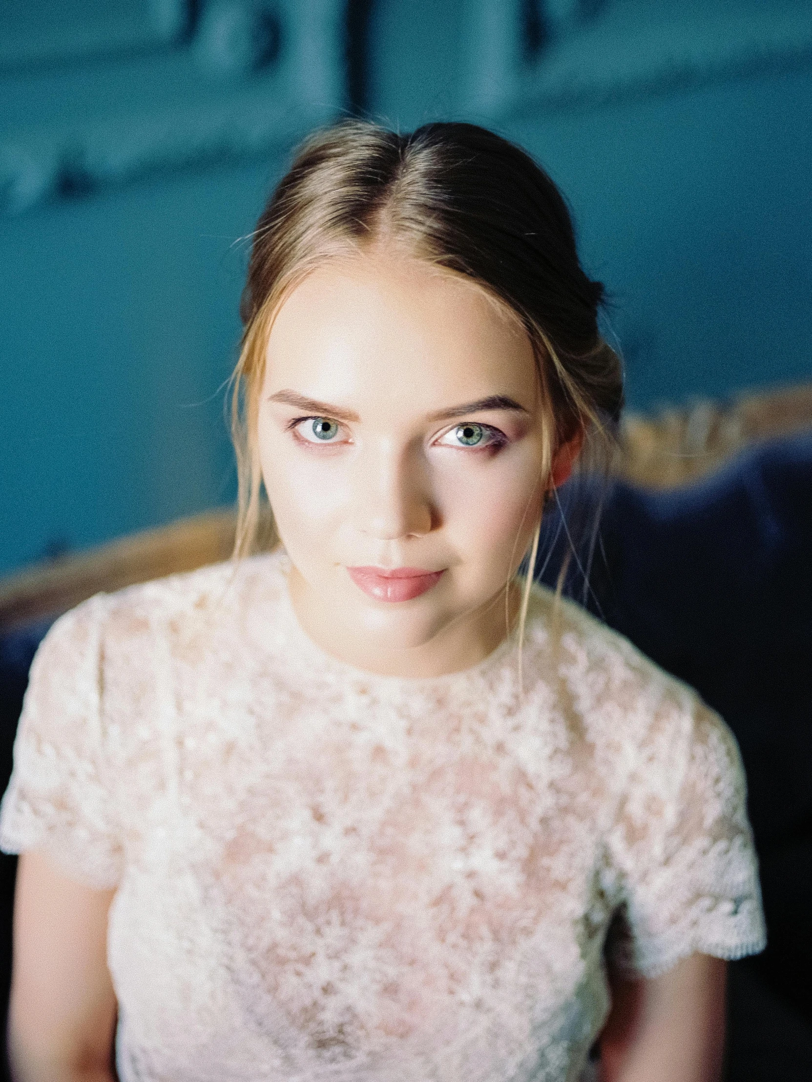 a woman in a white dress sitting on a couch, inspired by Louisa Matthíasdóttir, unsplash, looks directly at camera, sydney sweeney, wedding, headshot