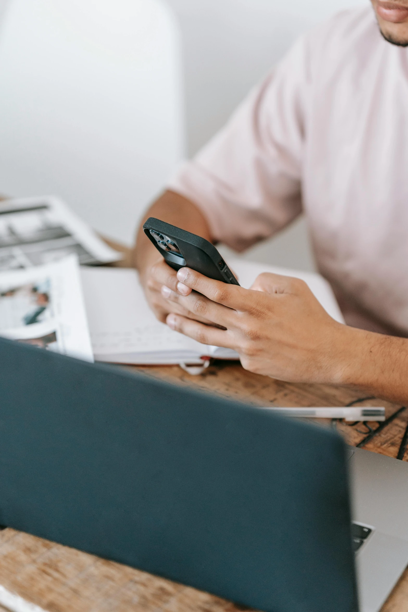 a man sitting at a table using a cell phone, trending on pexels, happening, corporate phone app icon, sat at a desk, brown, 1 2 9 7