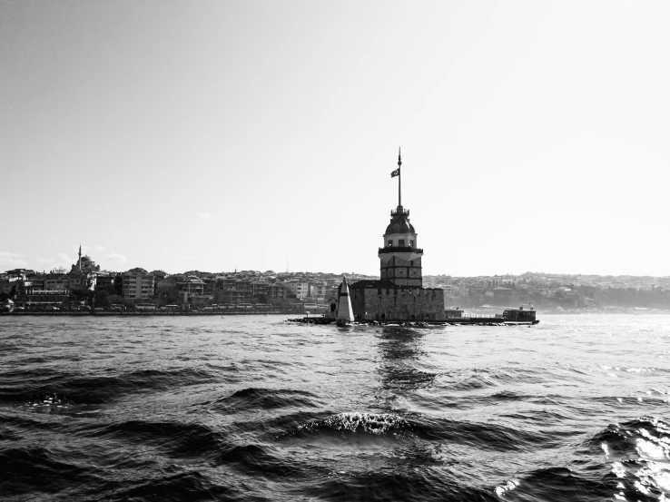 a black and white photo of a large body of water, by Niyazi Selimoglu, tower, military, photographic print, high quality image