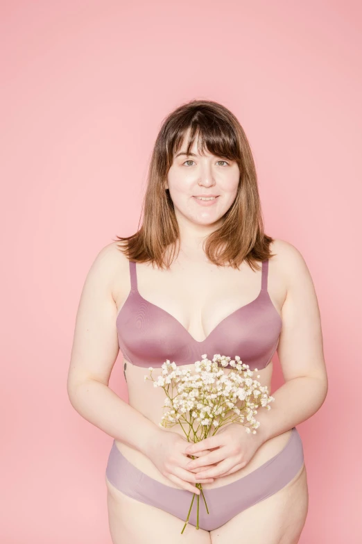 a woman in underwear holding a bouquet of flowers, a colorized photo, by Arabella Rankin, unsplash, posing together in bra, on a pale background, rebecca sugar, soft curvy shape